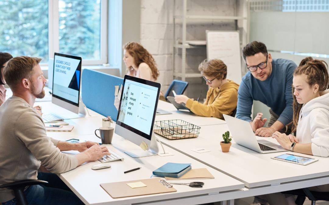 Student learning Microsoft Office applications including Word, Excel, PowerPoint, and Outlook during PC Applications career training class.