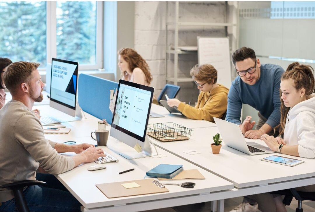 Student learning Microsoft Office applications including Word, Excel, PowerPoint, and Outlook during PC Applications career training class.
